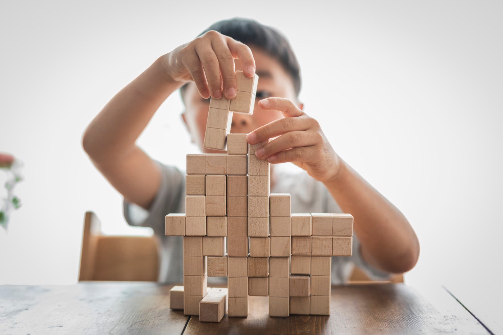 child building jenga blocks mobile.jpg