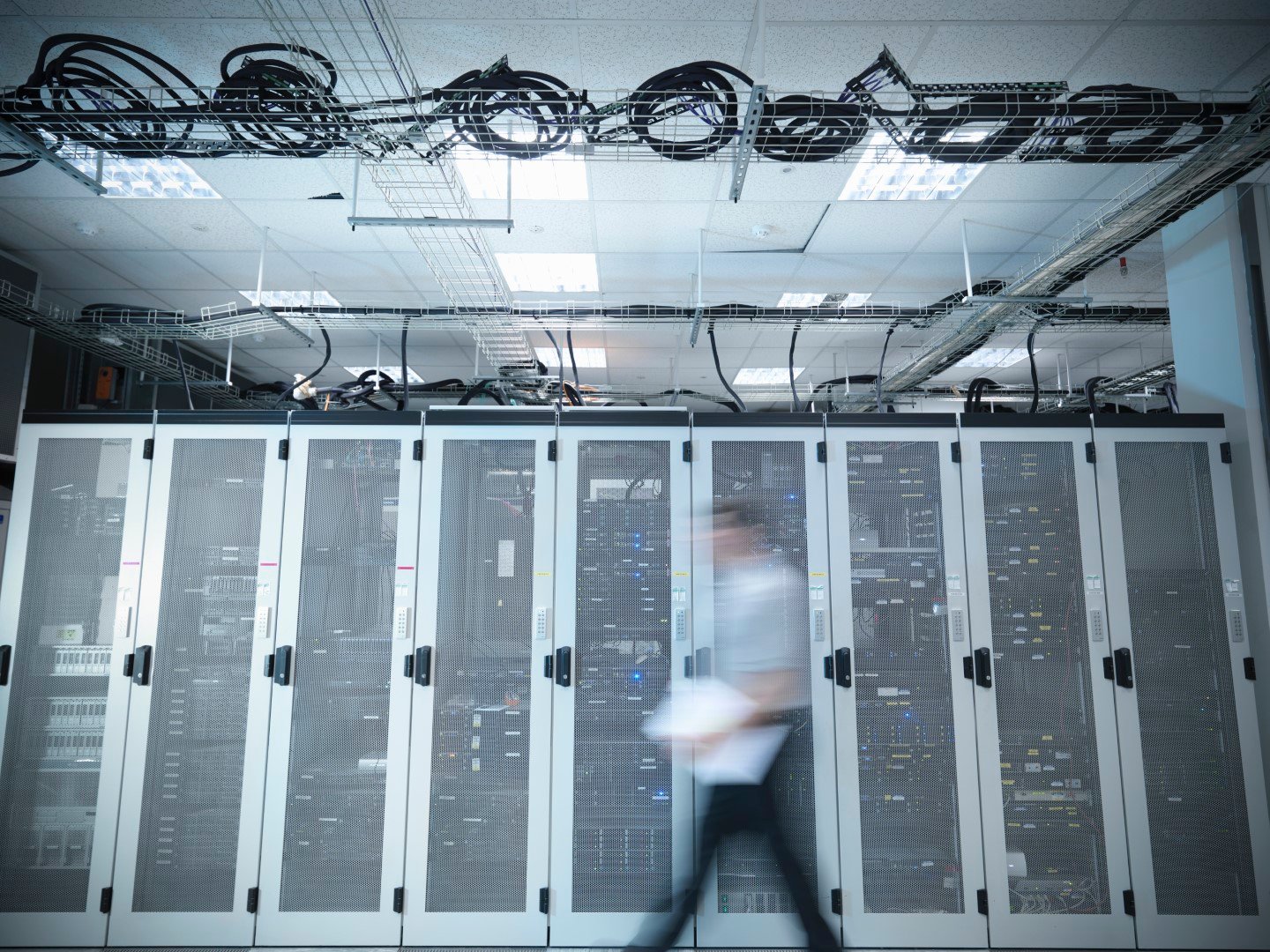 Man walking through server room.jpg