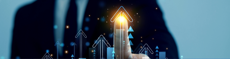 Man in suit pointing at arrow going up