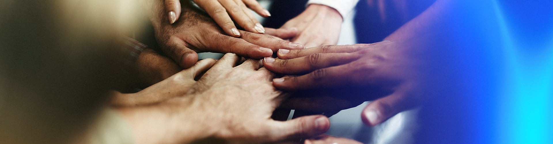 closeup-of-diverse-people-joining-their-hands.jpg